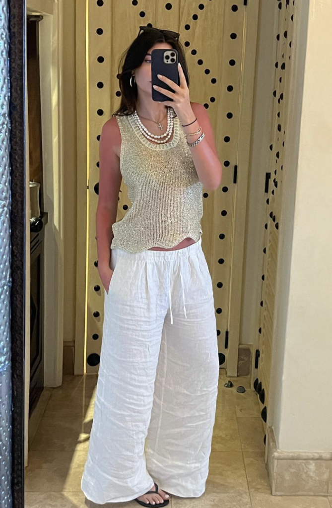 A shimmering metallic top with wide-leg pants brings a touch of glamour to any beach party or gathering.